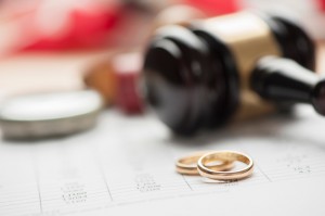 Gavel and wedding rings